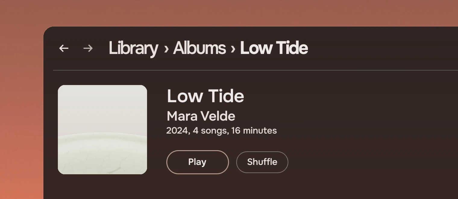 Part of the Music window on an album's page: a cover, the title Low Tide, the artist Mara Velde as a link under it, the year, number of songs and length, and the actions Play and Shuffle.