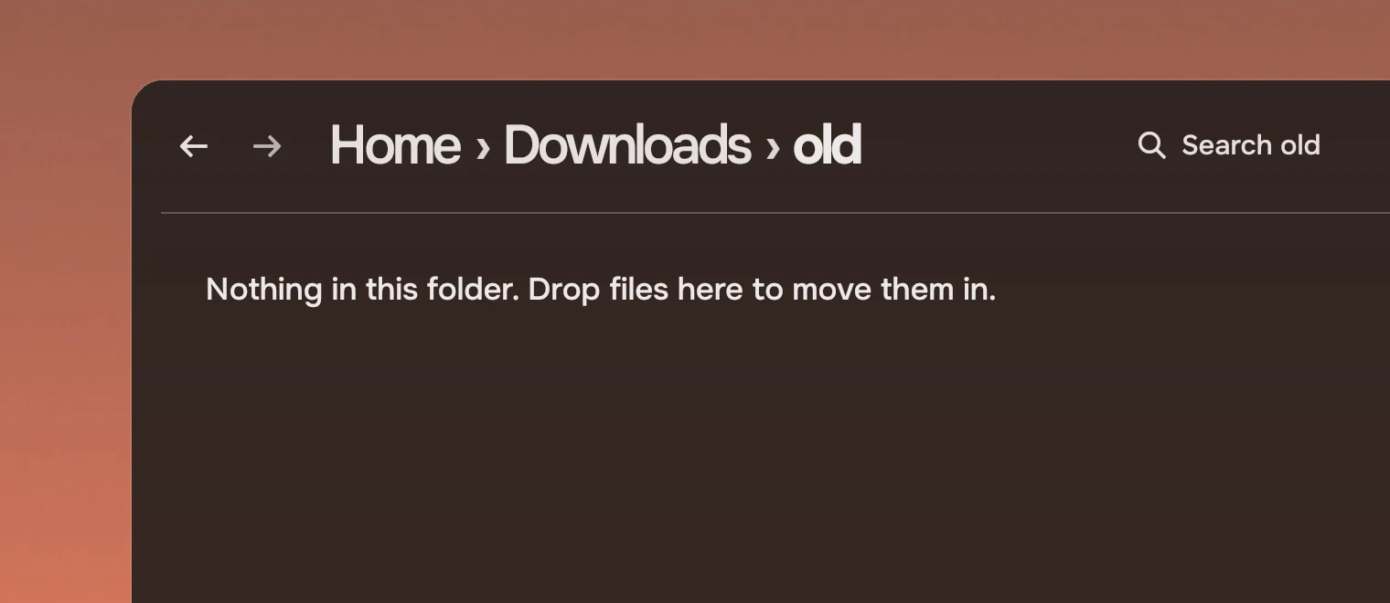 Part of a window whose page header shows the path Home, Downloads, old, and under it, where the first row would start, one sentence: Nothing in this folder. Drop files here to move them in.