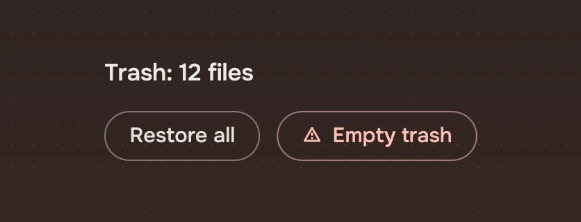 A view titled Trash: 12 files with a quiet Restore all and a risk Empty trash with the warning symbol, last.